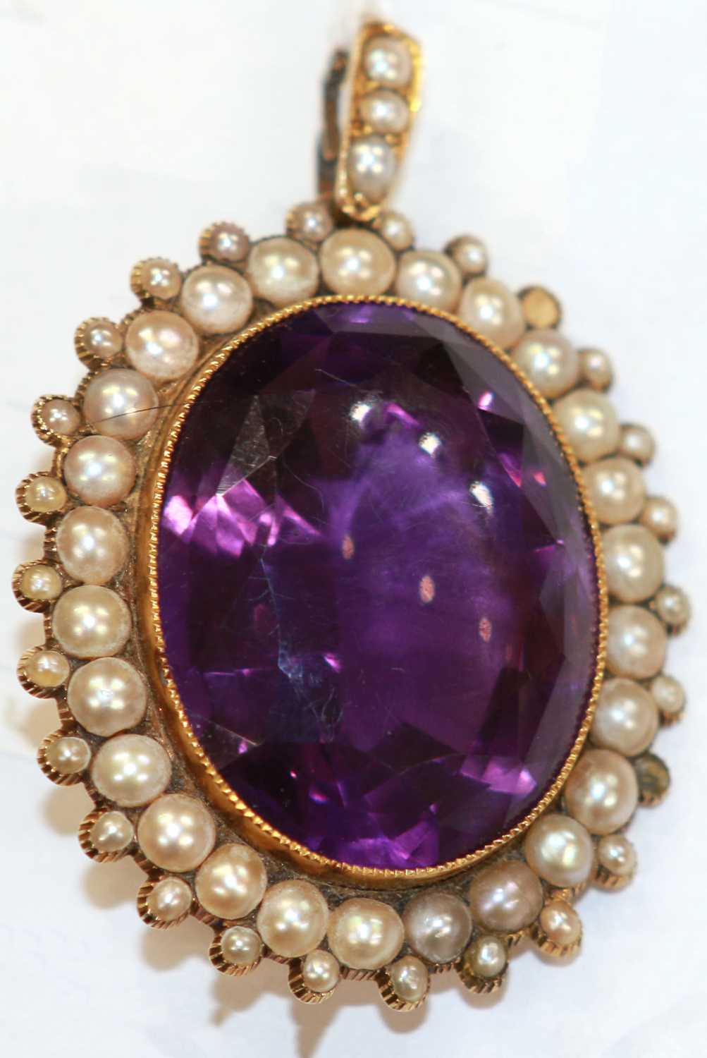 An antique Amethyst and split pearl pendant circa 1830