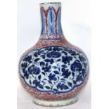 A Chinese Underglaze Red and Blue Bottle Vase in Ming Style.