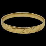 A Heavy 9ct Yellow Gold Bangle.