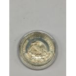 1947 Silver Mexican Cinco Pesos.