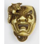 Japanisches Elfenbein-Netsuke, Meji-Periode, fein geschnitzte Darstellung eines Gesicht mit