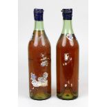 2 Flaschen J. & F. Martell Cognac, 1950er Jahre, mit orig. Verkapselung, Etiketten fast völlig