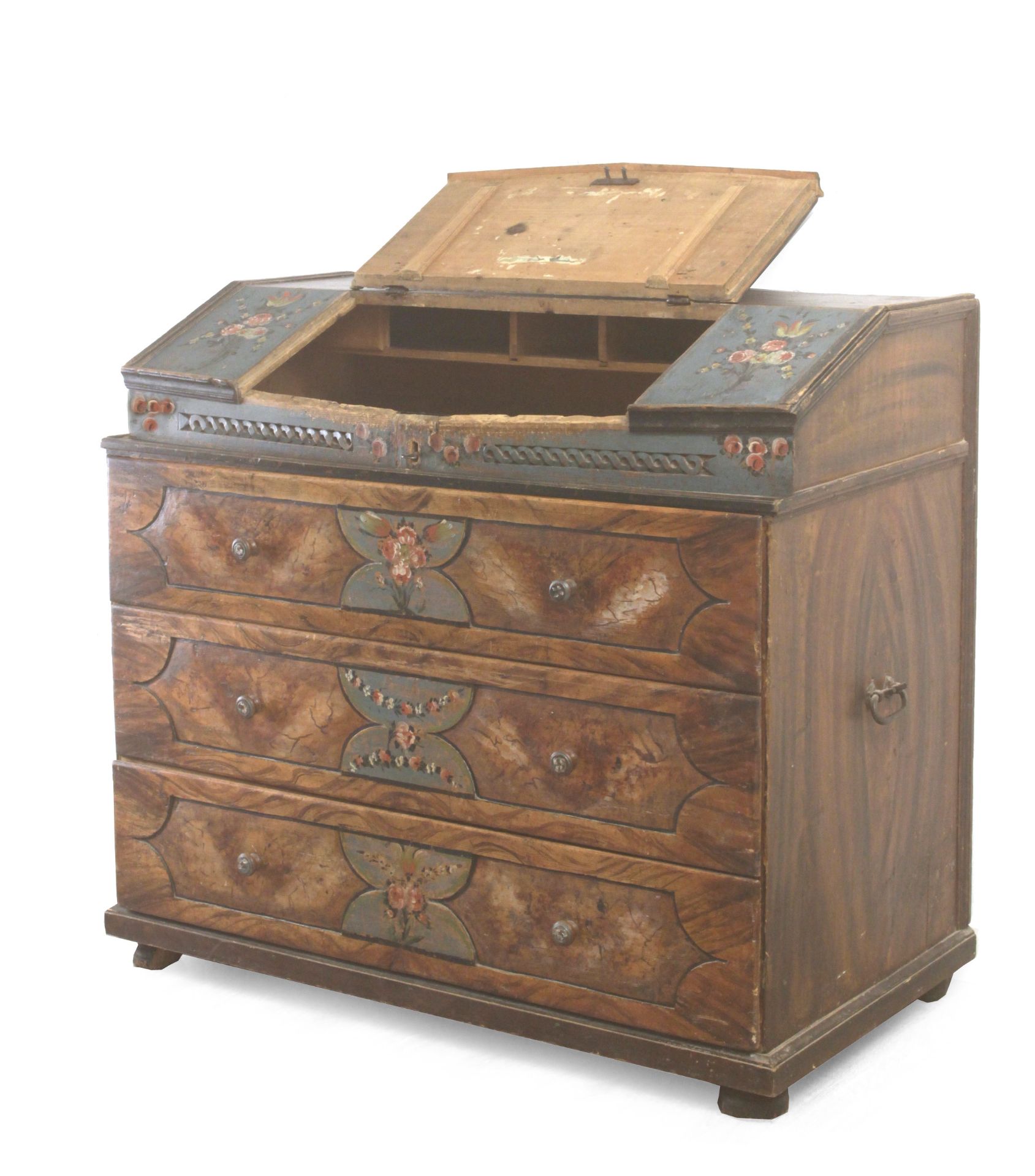 A late 18th century carved and polychromed pine sacristy chest of drawers