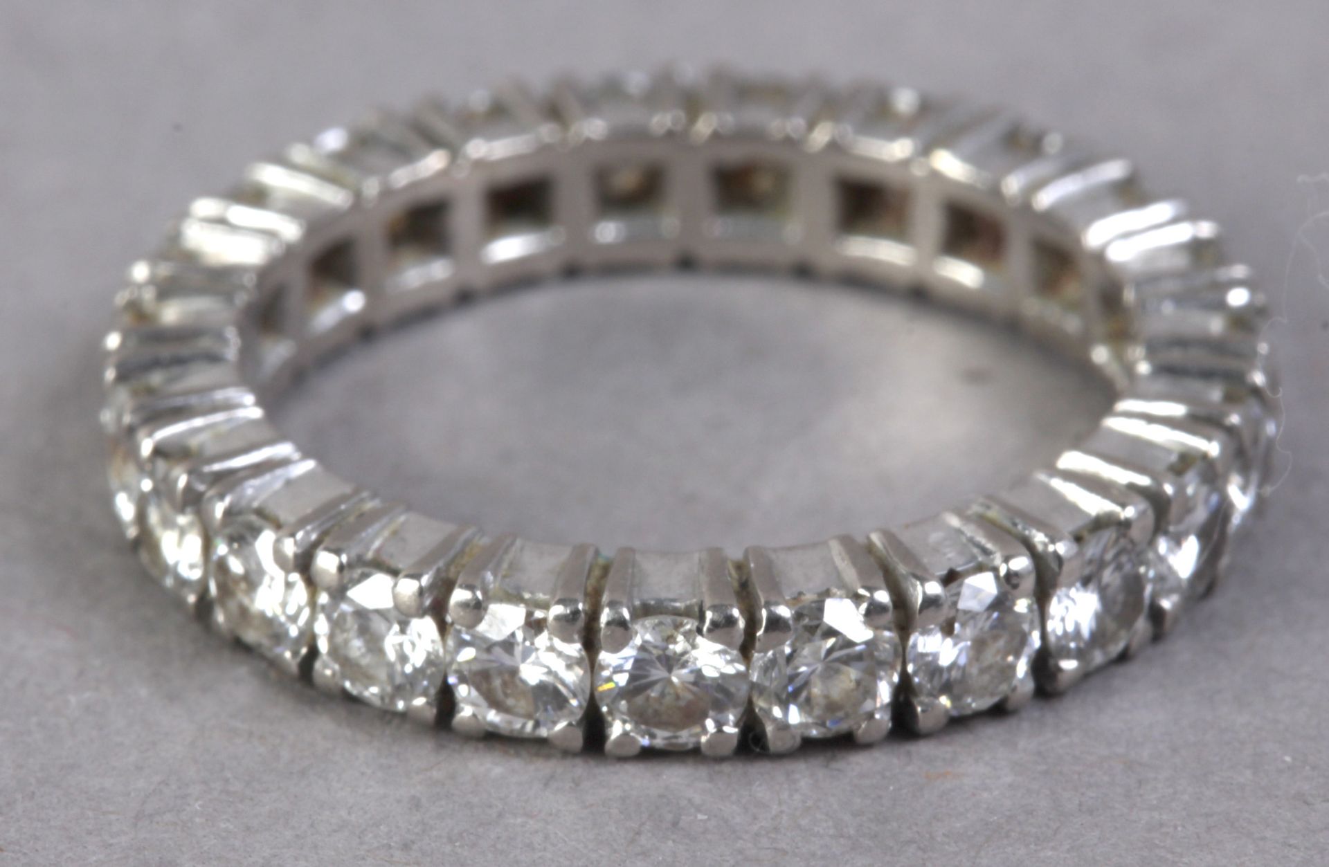 A diamond eternity ring with a platinum setting - Image 2 of 3