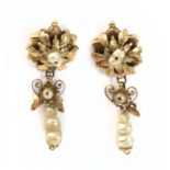 A pair of 19th century long pearl earrings with freshwater pearls and an 18k. yellow gold setting