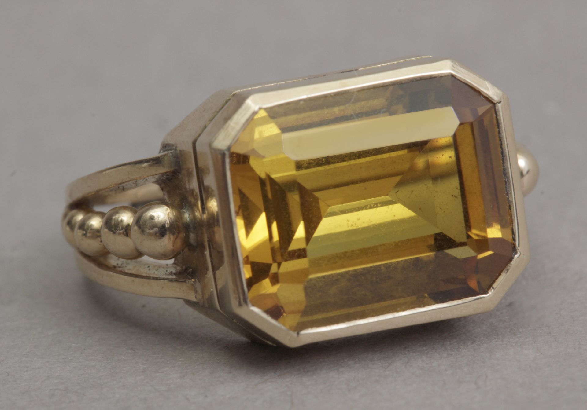 A first half of 20th century ring with a synthetic corundum and an 18k. yellow gold setting