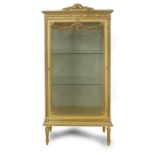 A 20th century Louis XVI style glass cabinet