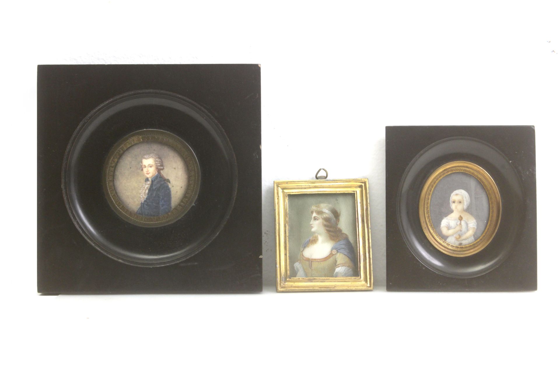 A collection of three portrait miniatures