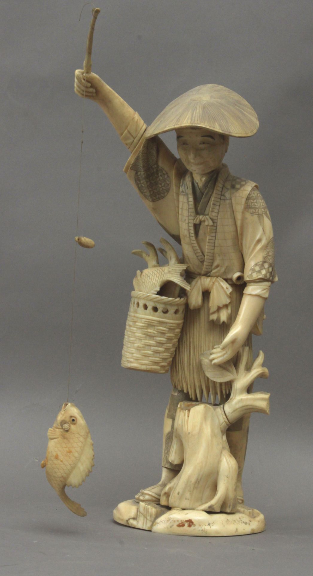 A 19th century Japanese okimono of a fisherman