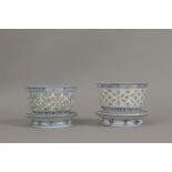 A pair of late 19th century Chinese cups in rice grain porcelain