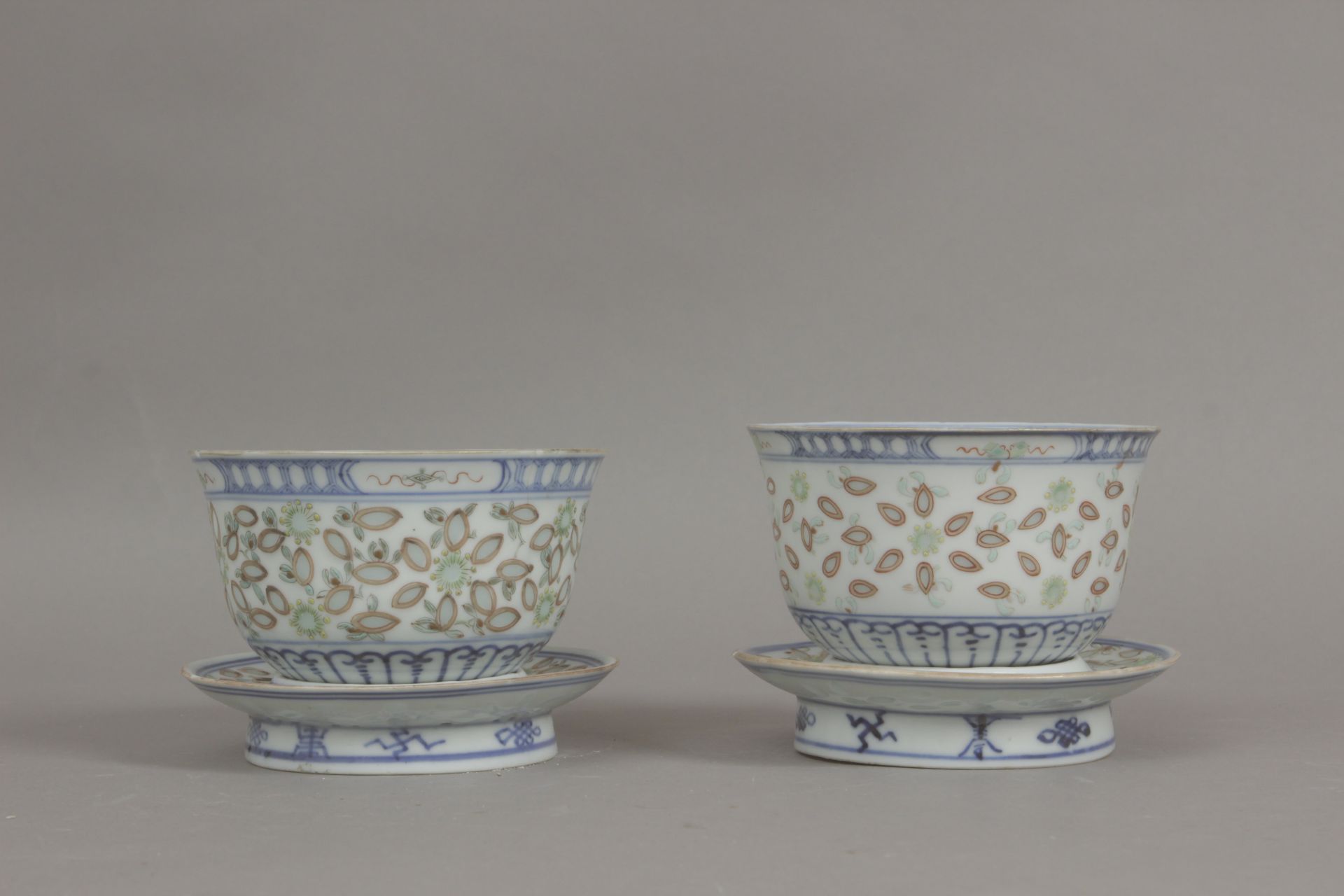 A pair of late 19th century Chinese cups in rice grain porcelain