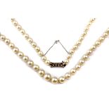 A cultured pearls necklace with a white gold and diamond clasp