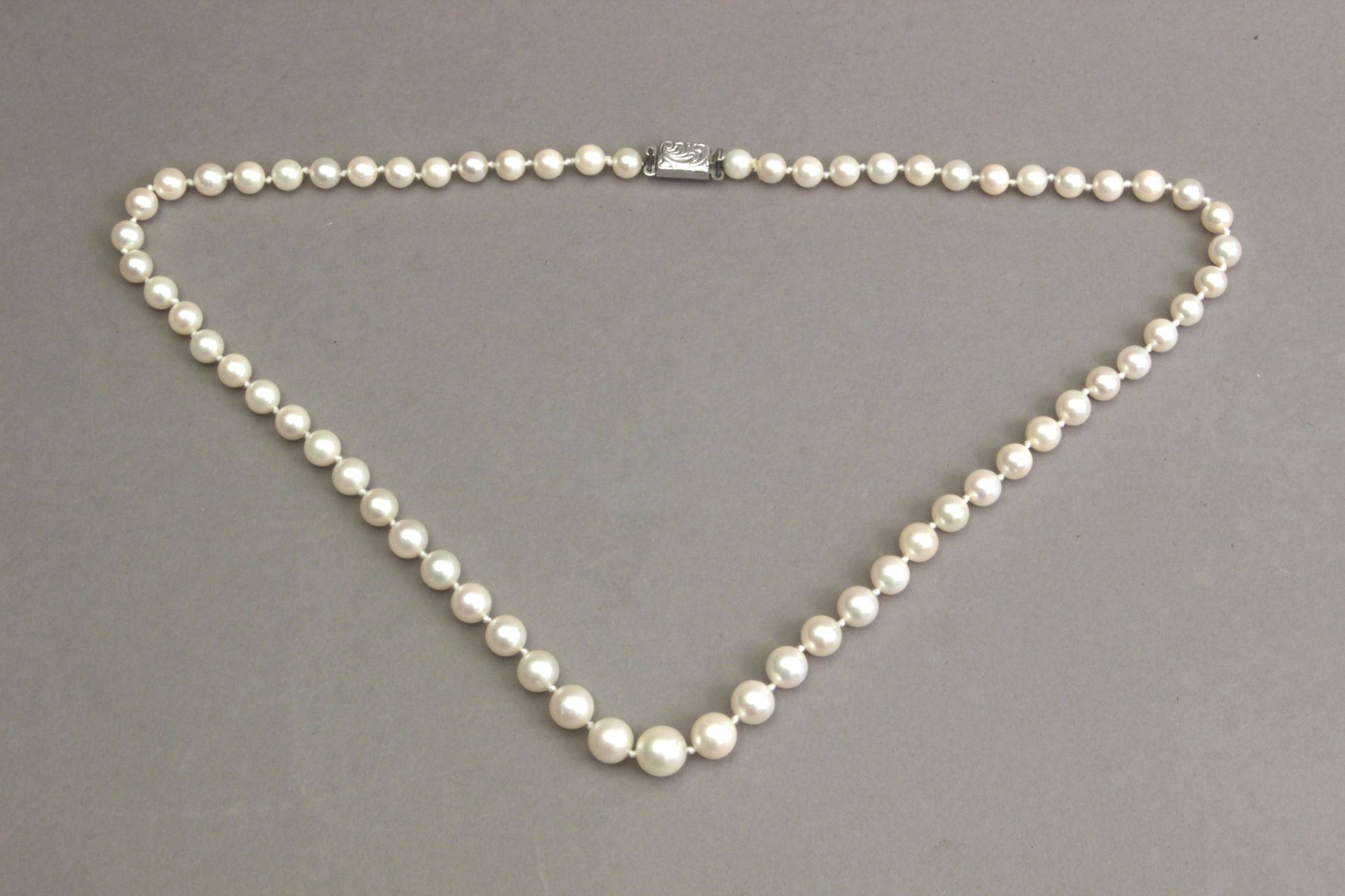 A cultured pearls necklace with a silver clasp