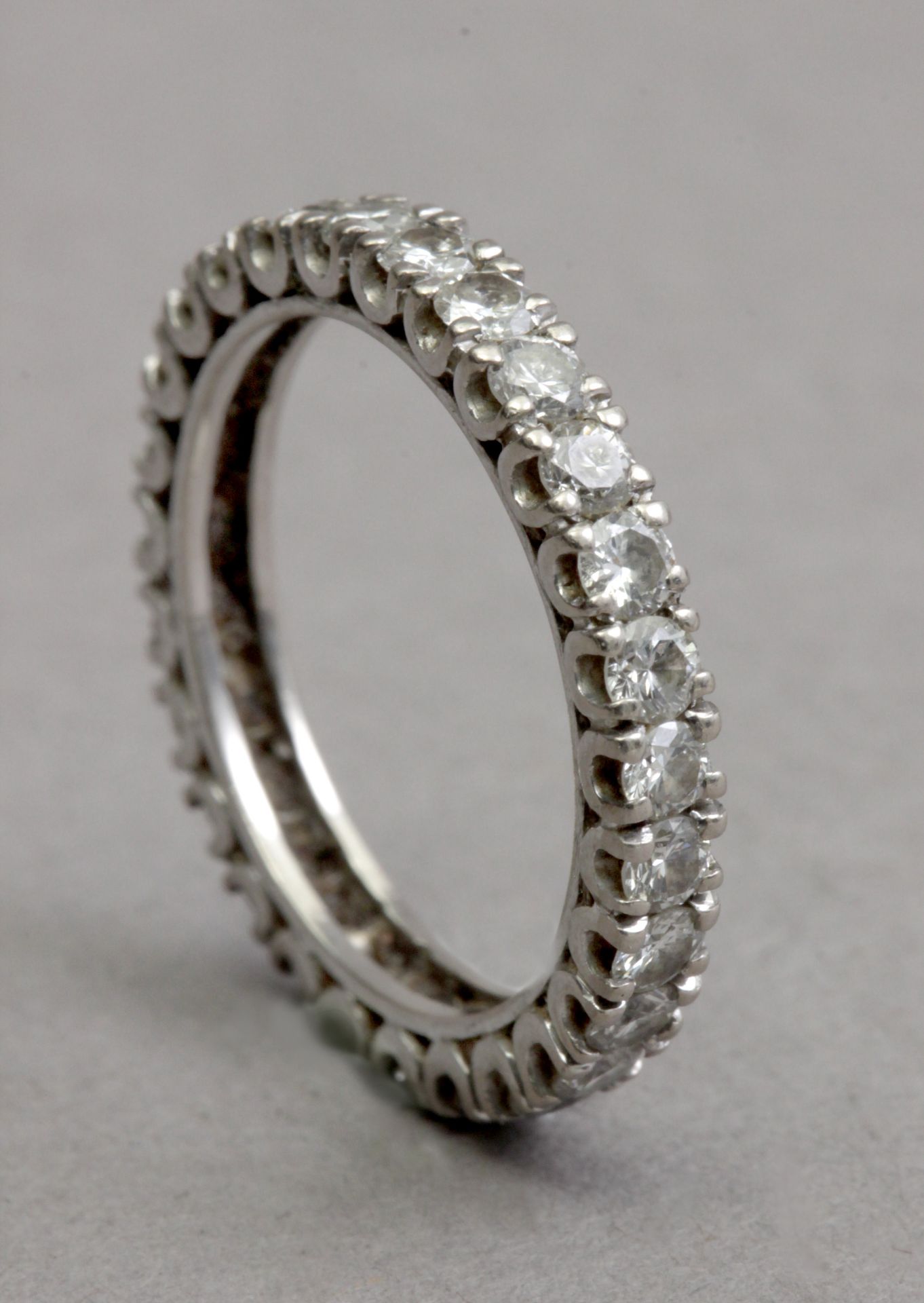 A diamond eternity ring with an 18k. white gold setting