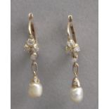 A pair of early 20th century earrings. Yellow gold, rose cut diamonds and pearls