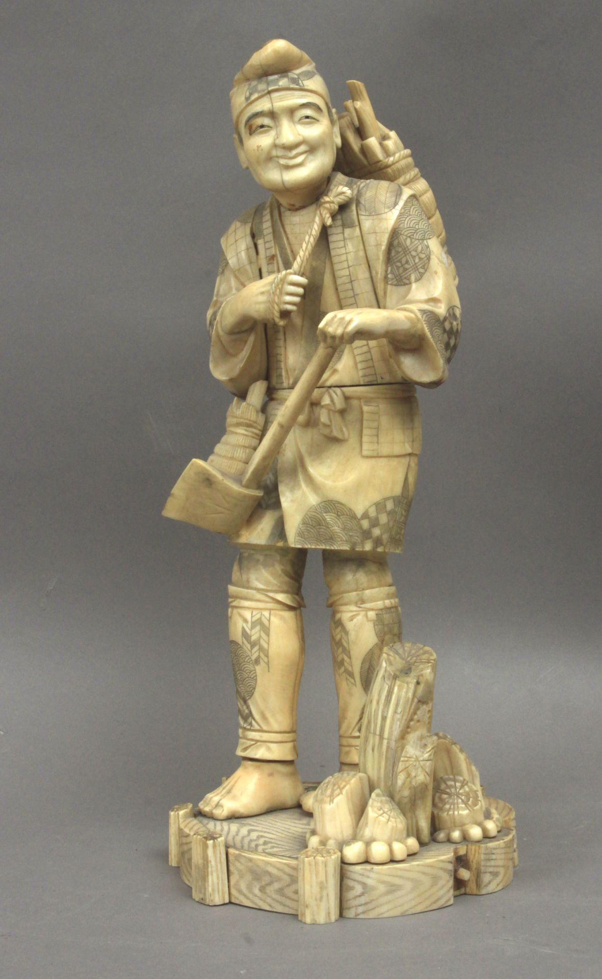 A 19th century Japanese okimono of a woodcutter