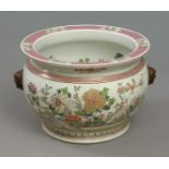 A 19th century Chinese cachepot in Famille Rose porcelain