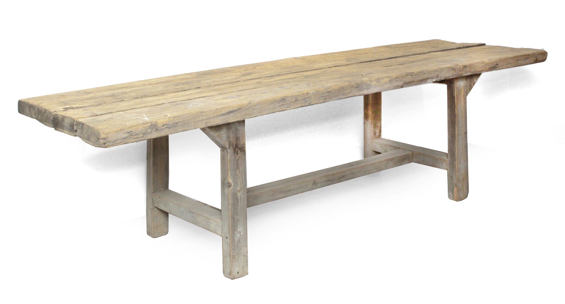 A rustic style pine dining table made with old boards