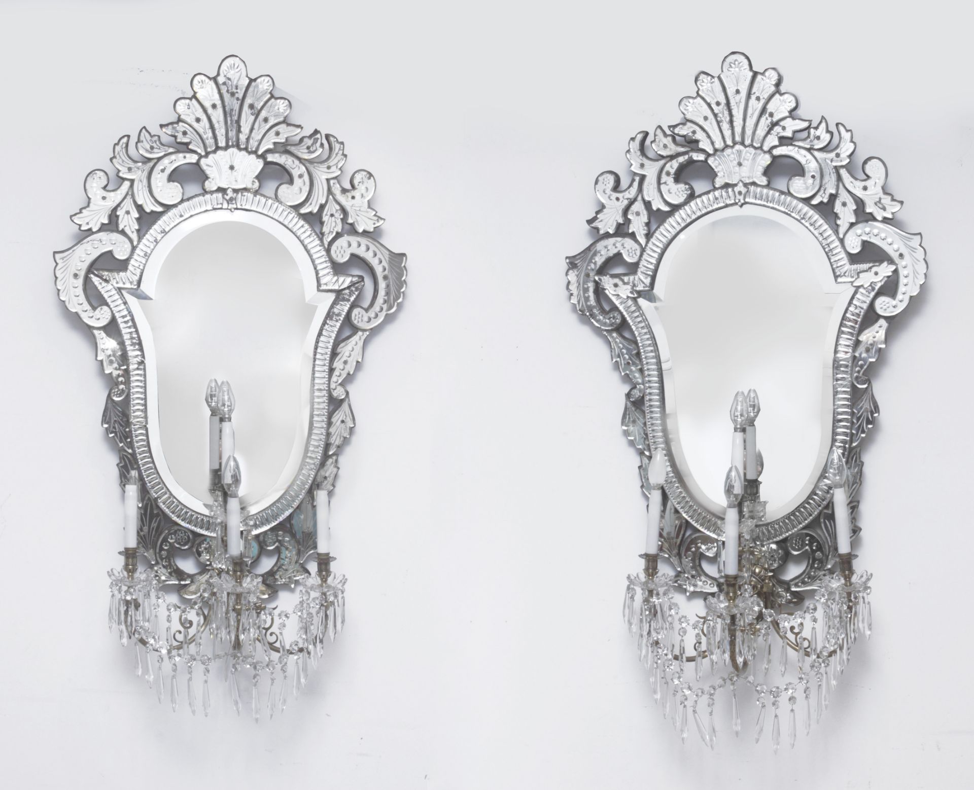 A pair of 19th century Venetian mirrors with four lights