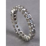 A diamond eternity ring with a platinum setting