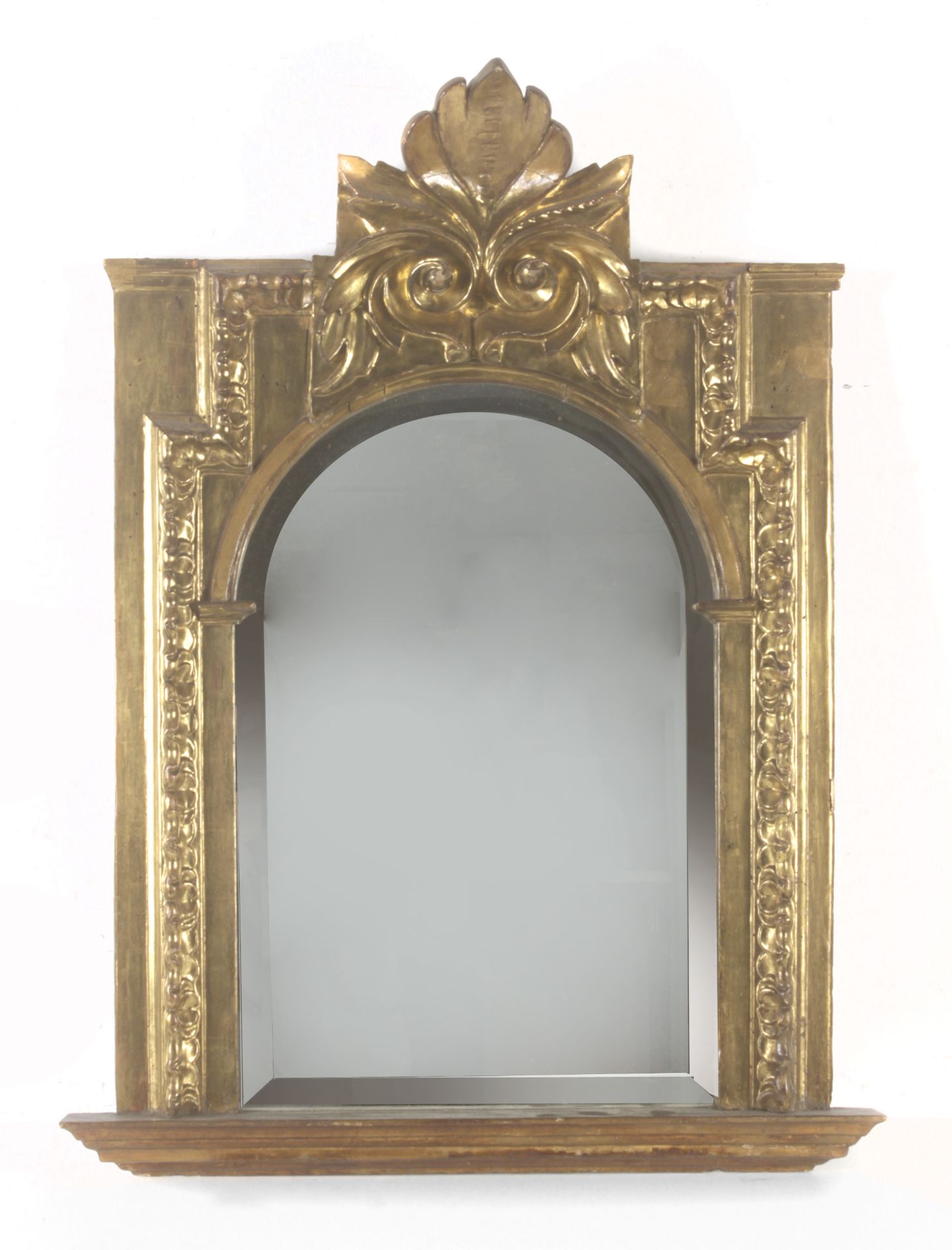 An 18th century carved and polychromed mirror