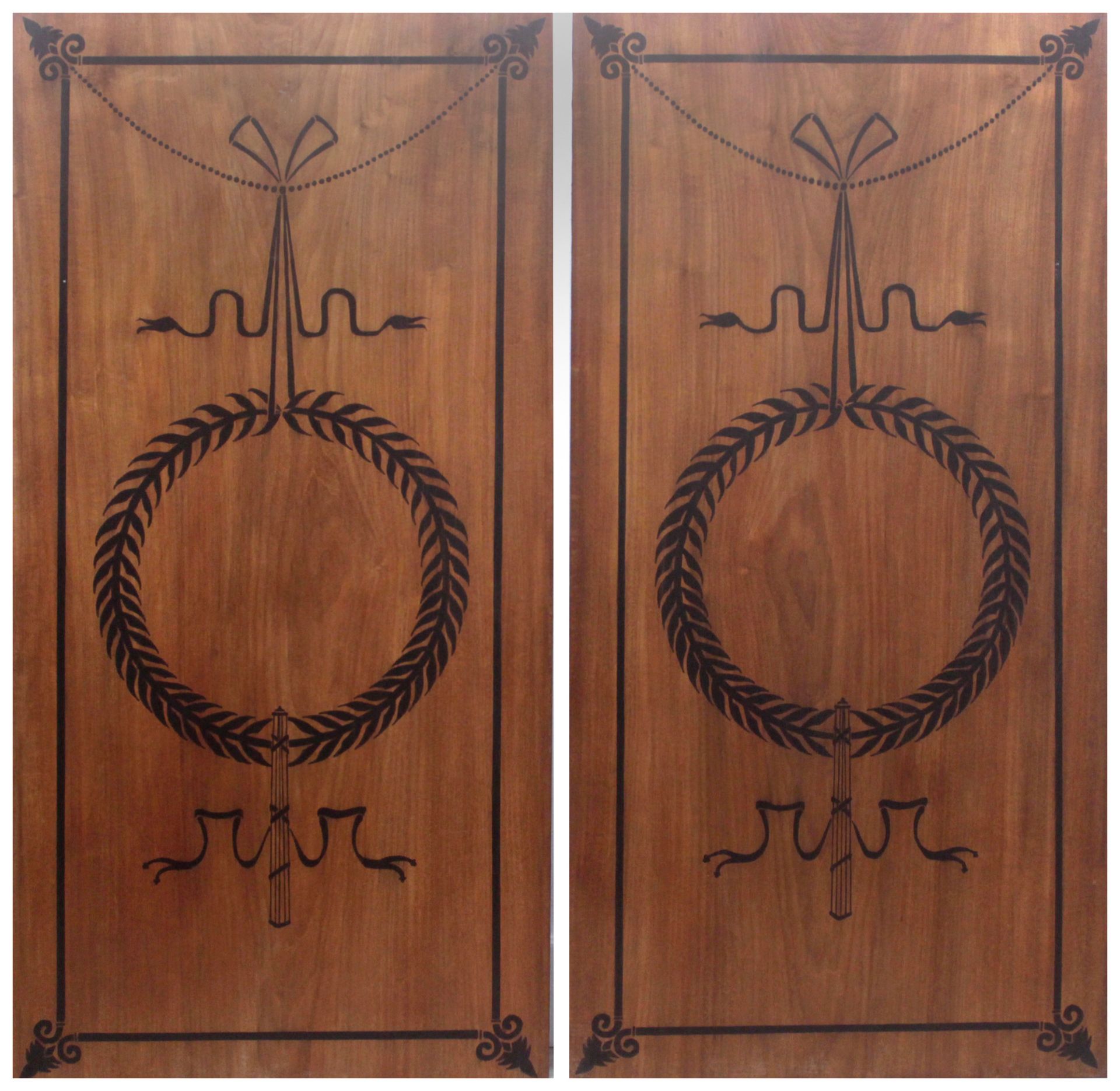 A pair of 20th century Empire style wall plaques