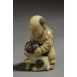 A mid 19th century Japanese netsuke. Signed Tomochika