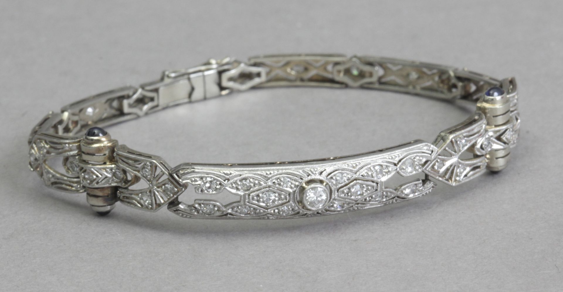 An Art-Déco bracelet circa 1920. Diamonds, sapphires, gold and platinum