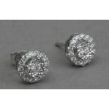 A pair of diamond stud earrings