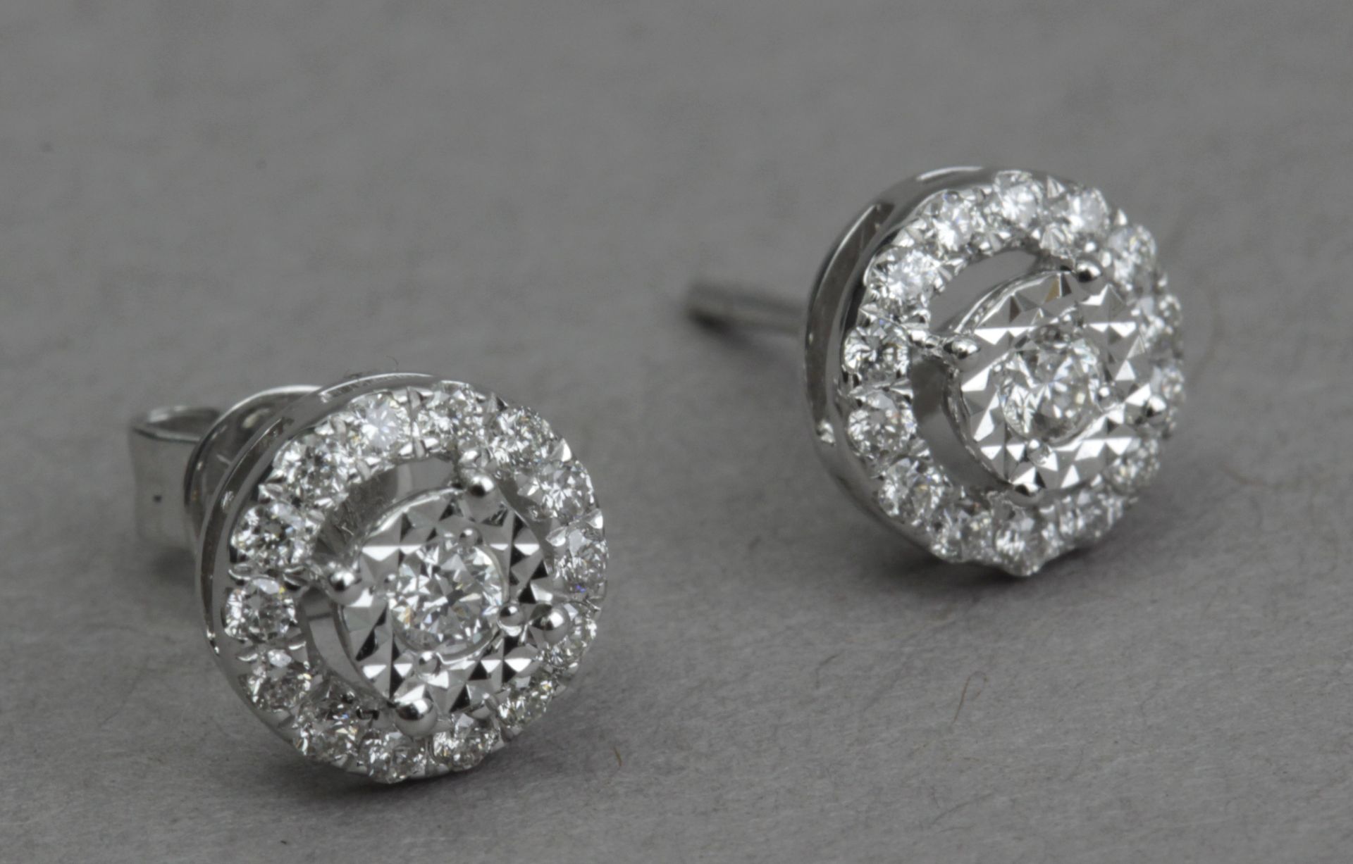 A pair of diamond stud earrings