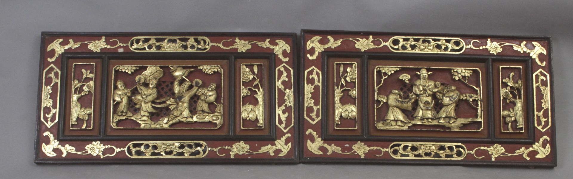 A pair of 20th century Chinese carved wall plaques