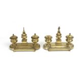 A pair of 20th century Empire style brass inkstands