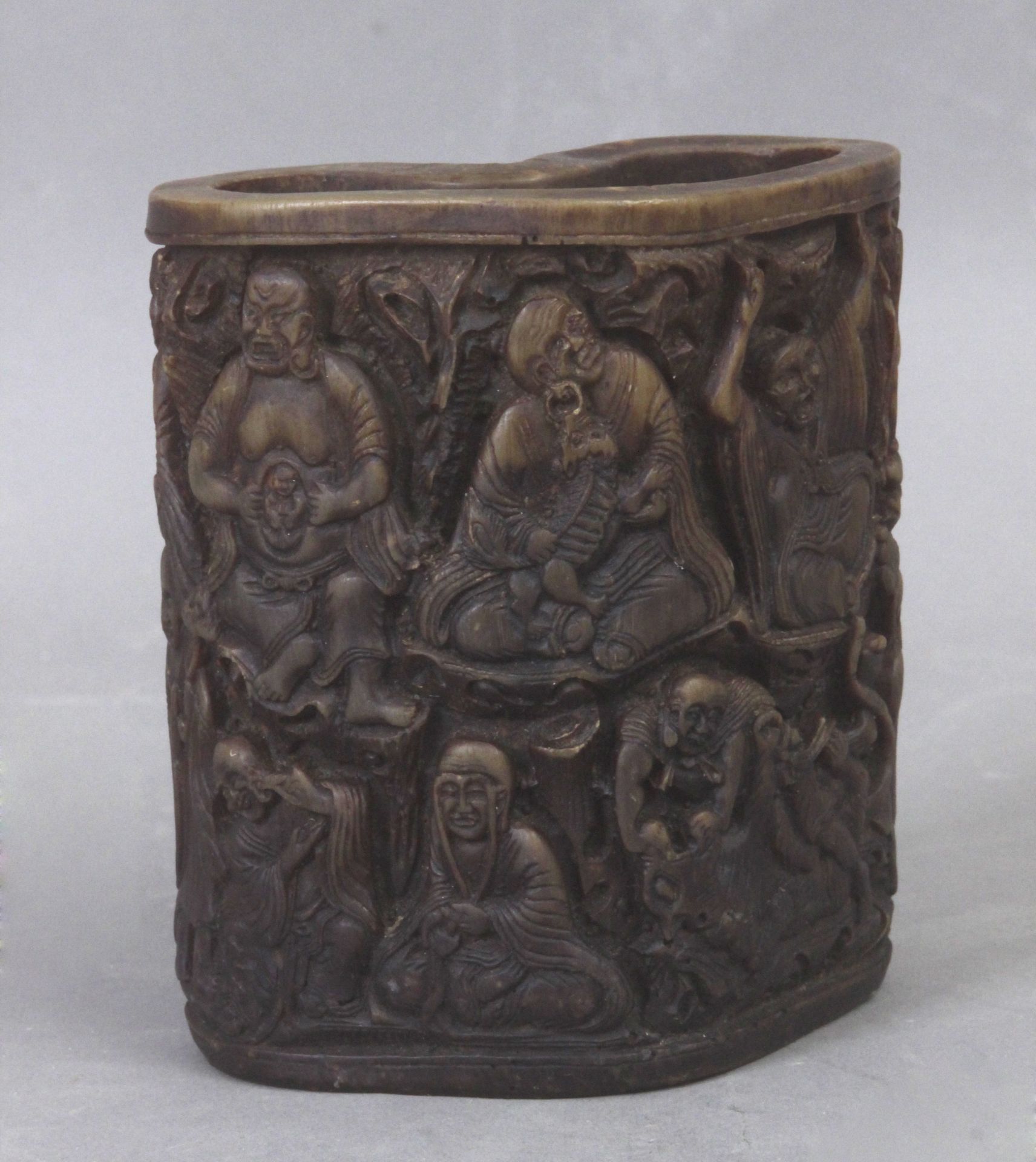 A carved rhino brush pot from Qing Dynasty