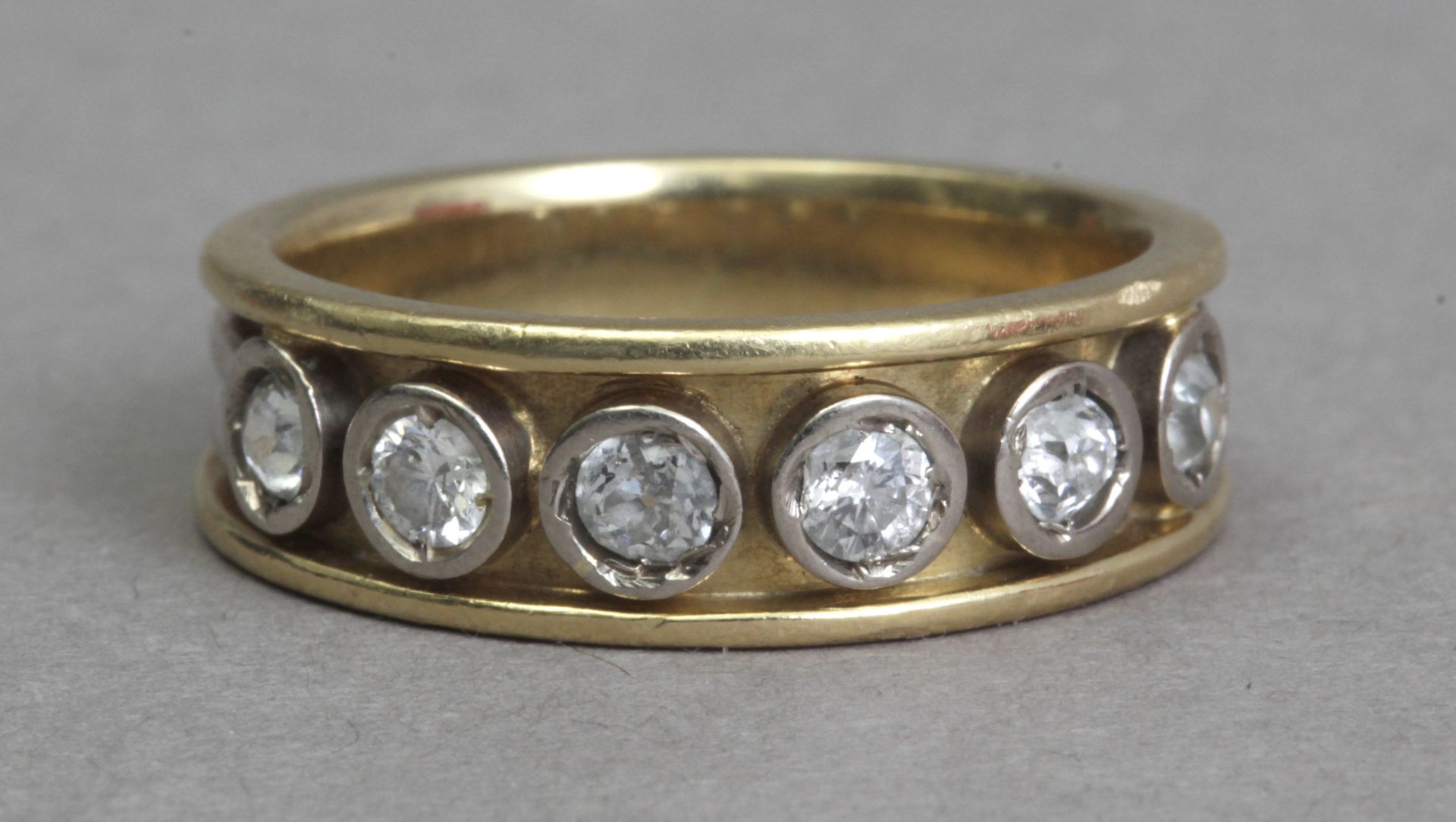 A first half 20th century diamond half eternity ring