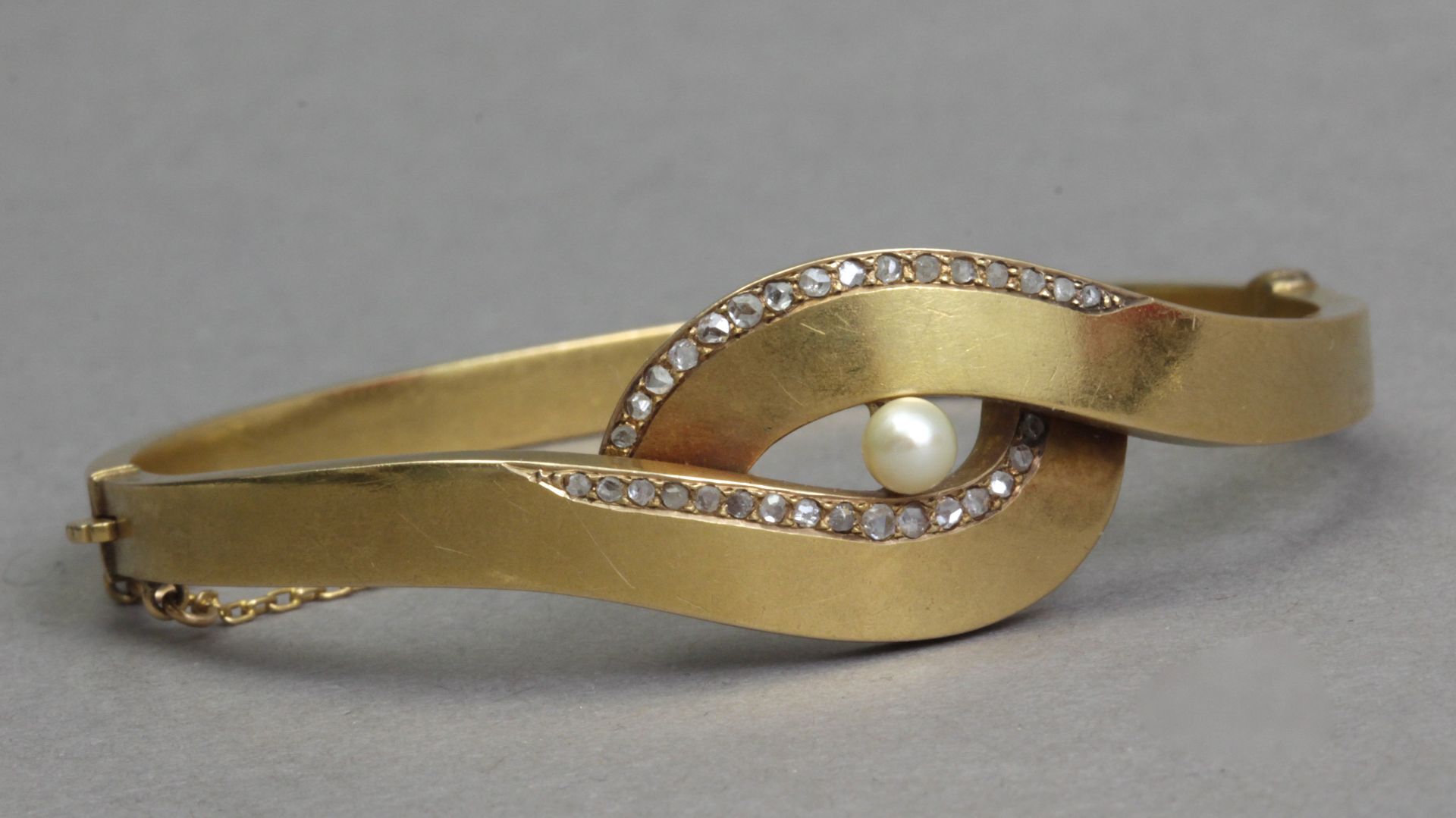 A mid 20th century diamond and pearl bracelet