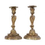 A pair of first half 20th century bronze candlesticks