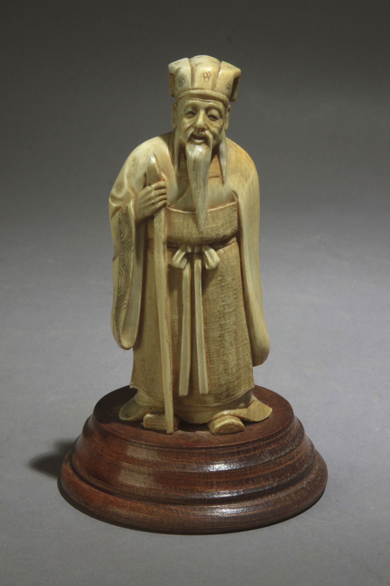 A Chinese ivory sculpture of a wiseman circa 1900