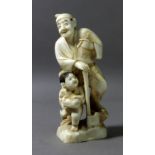 A 19th century Chinese ivory sculpture of a child and a lumberjack