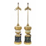 A pair of first half of 20th century Empire style bronze lamps