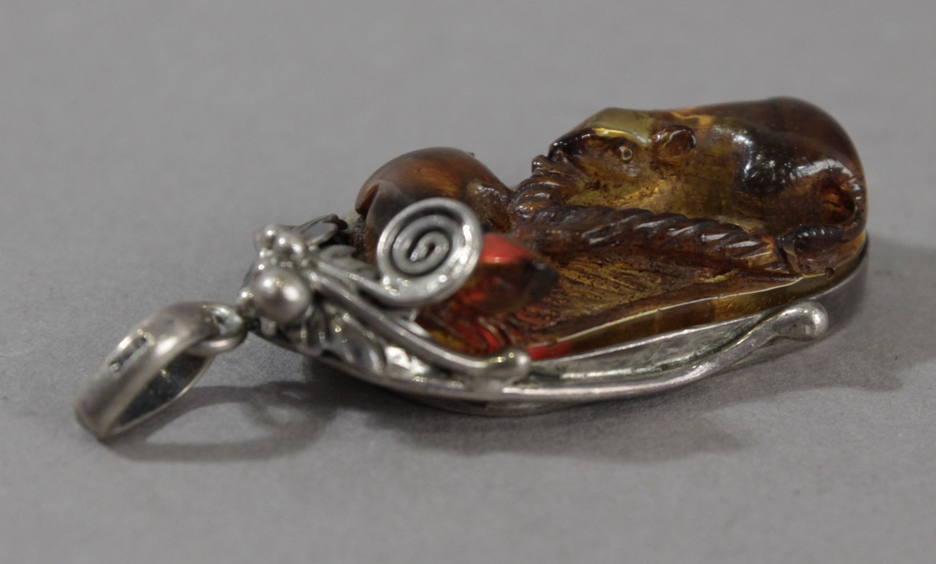 A19th century Japanese amber and silver pendant form Meiji period