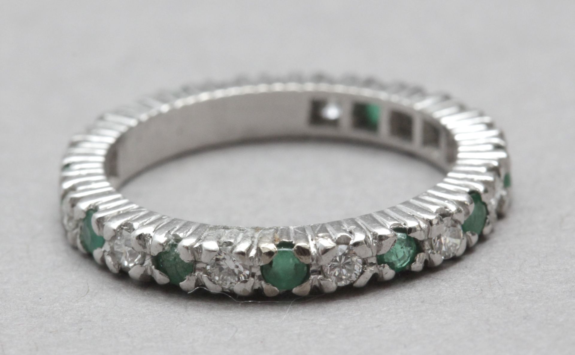 A brilliant cut diamonds and emeralds eternity ring - Image 2 of 2