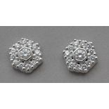 A brilliant cut diamond cluster earrings