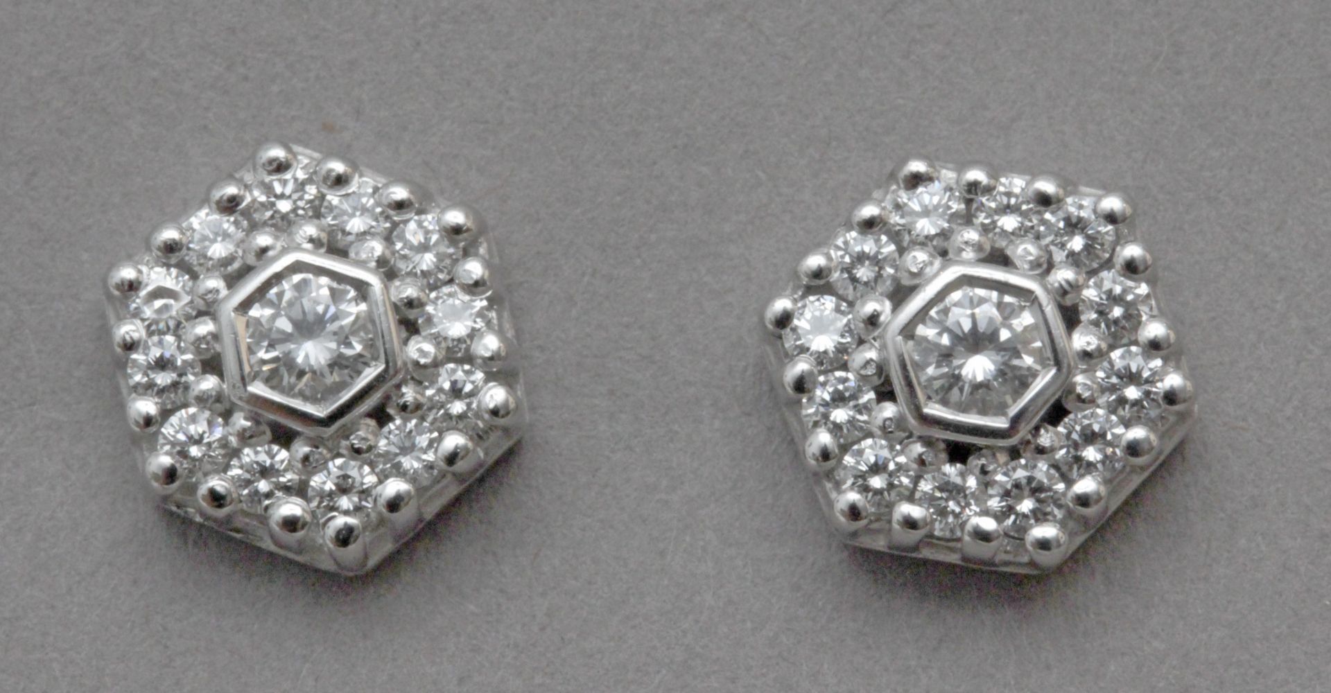 A brilliant cut diamond cluster earrings