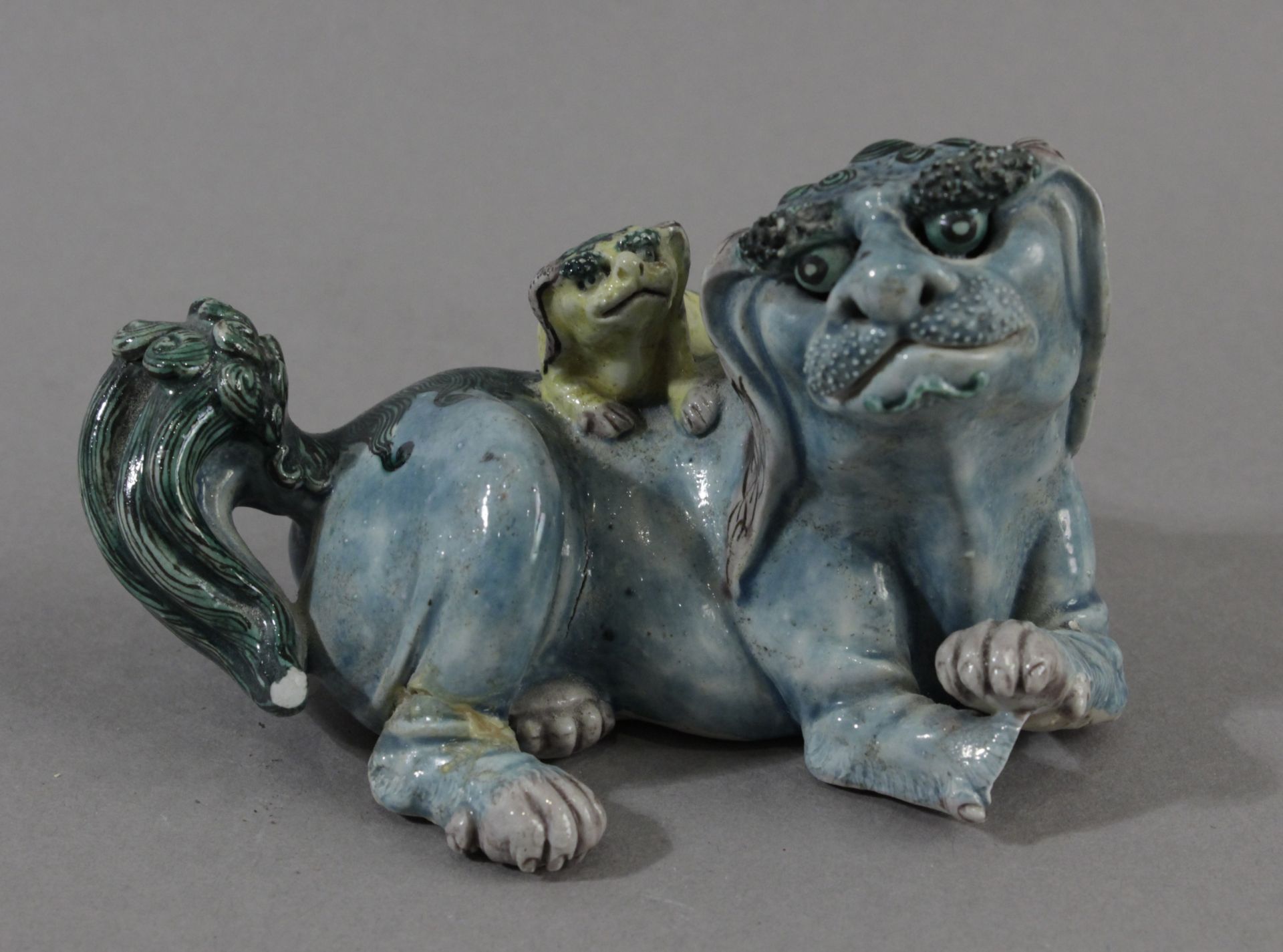 18th century Chinese chool. Figure of Fu guardian lion in plychromed porcelain