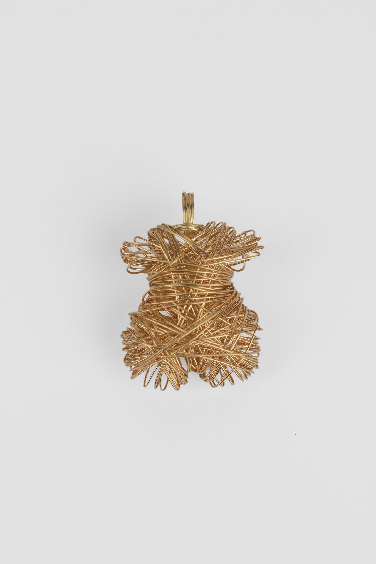 Tous. A limited edition 18k. yellow gold wire pendant