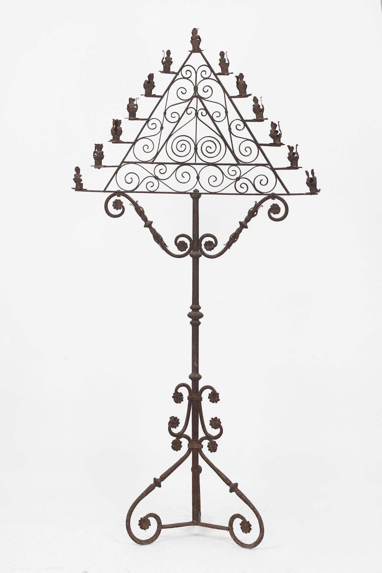 A wrough iron thirteen light torch stand circa 1900