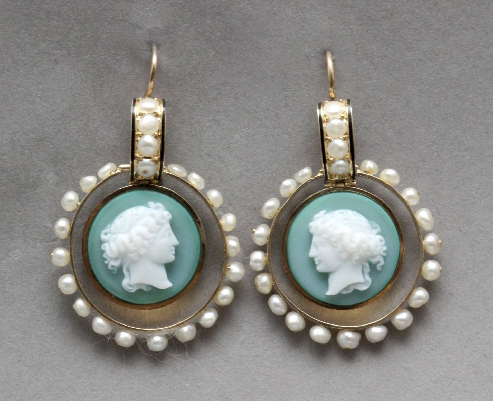 A pair of earrings circa 1900. Gold, Wedgood porcelain cameos and freshwater pearls