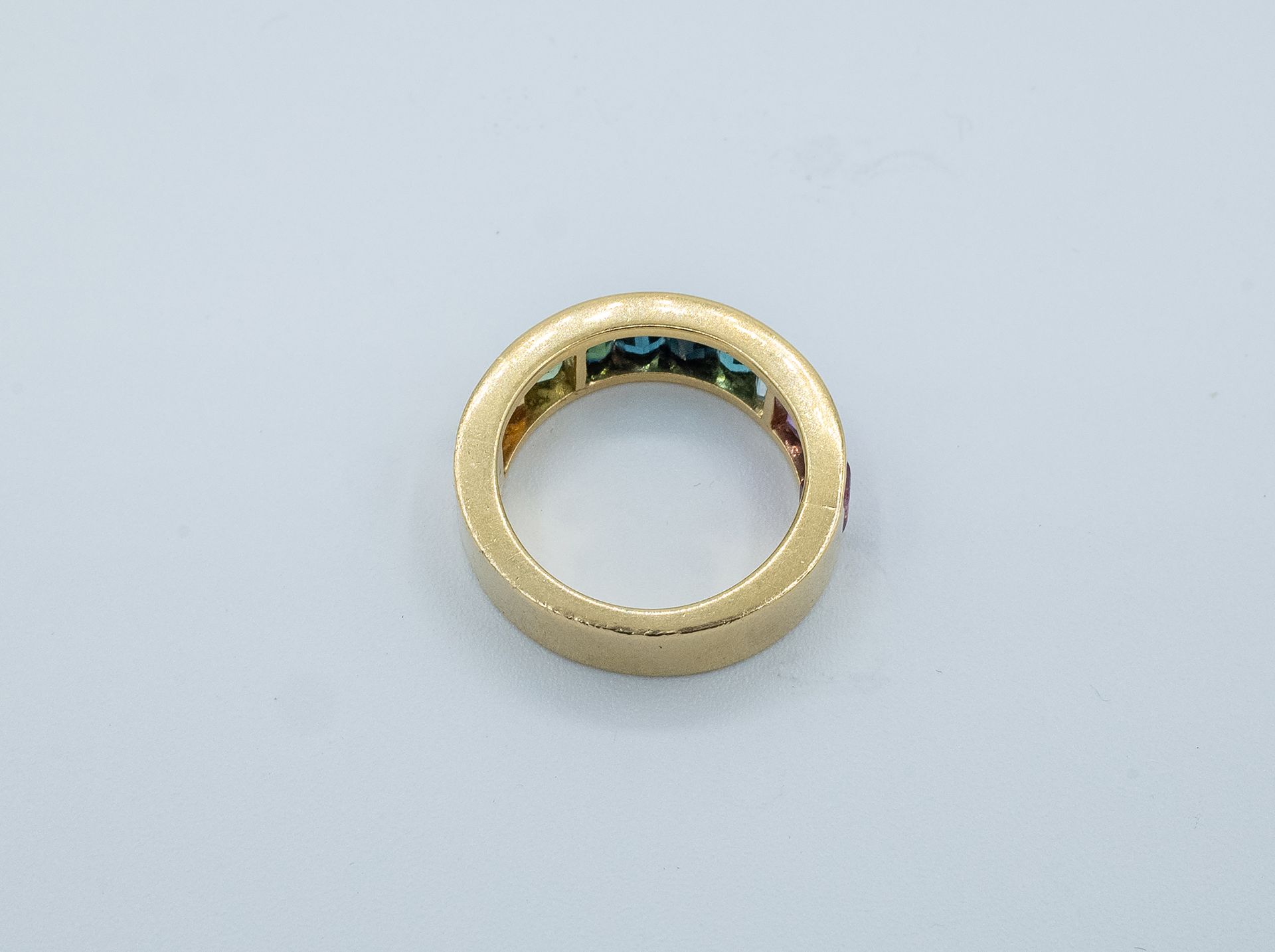 A rainbow half eternity ring with coloured stones - Image 2 of 3
