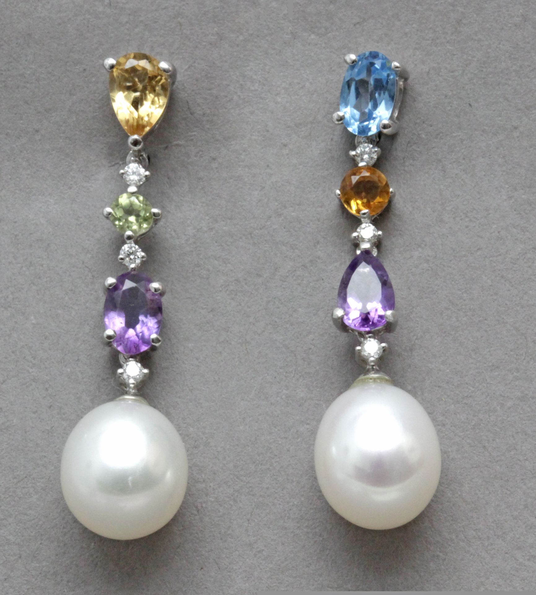 A pair of long earrings with topazes from Brazil and diamonds