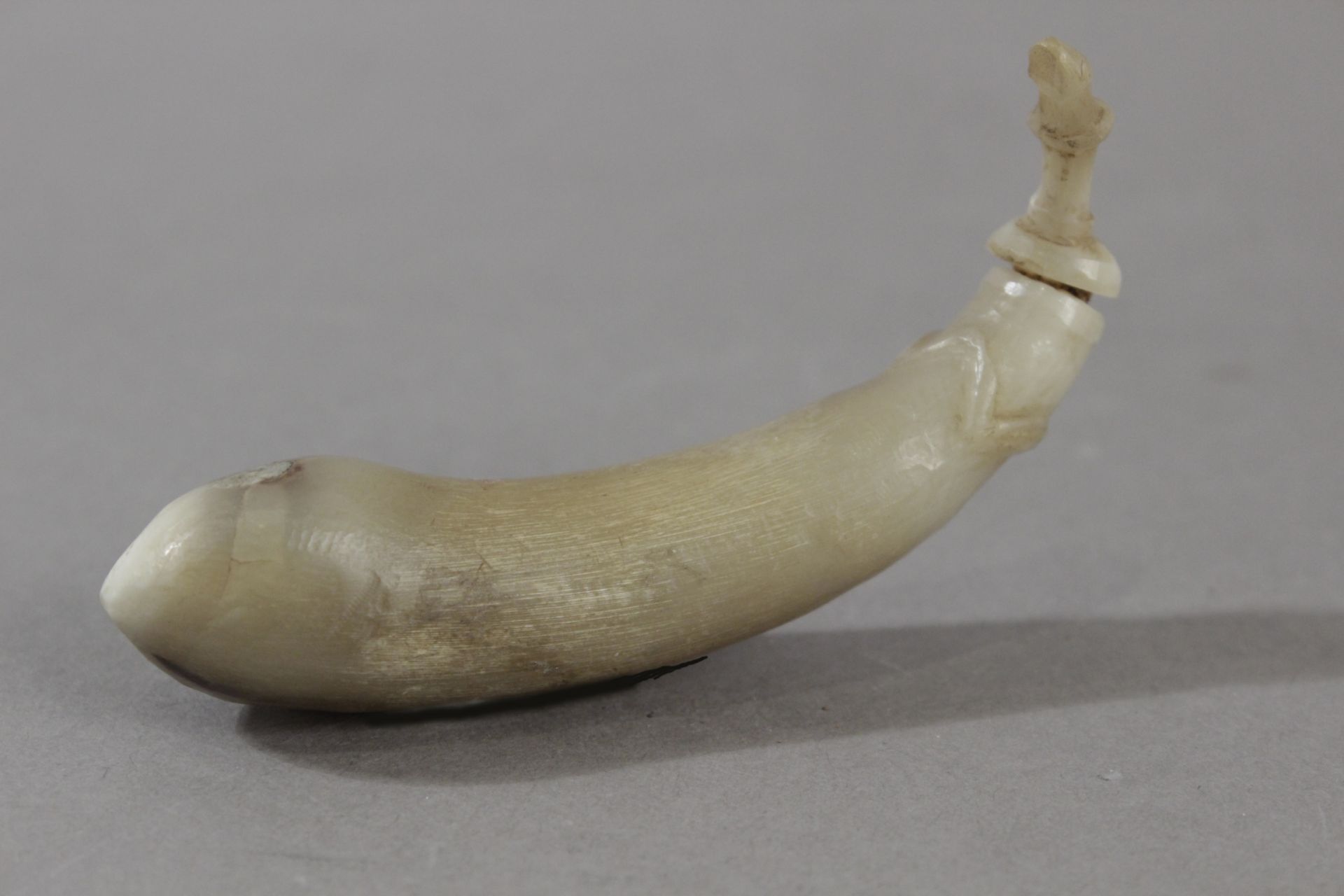 A 19th century Chinese snuff bottle in carved horn